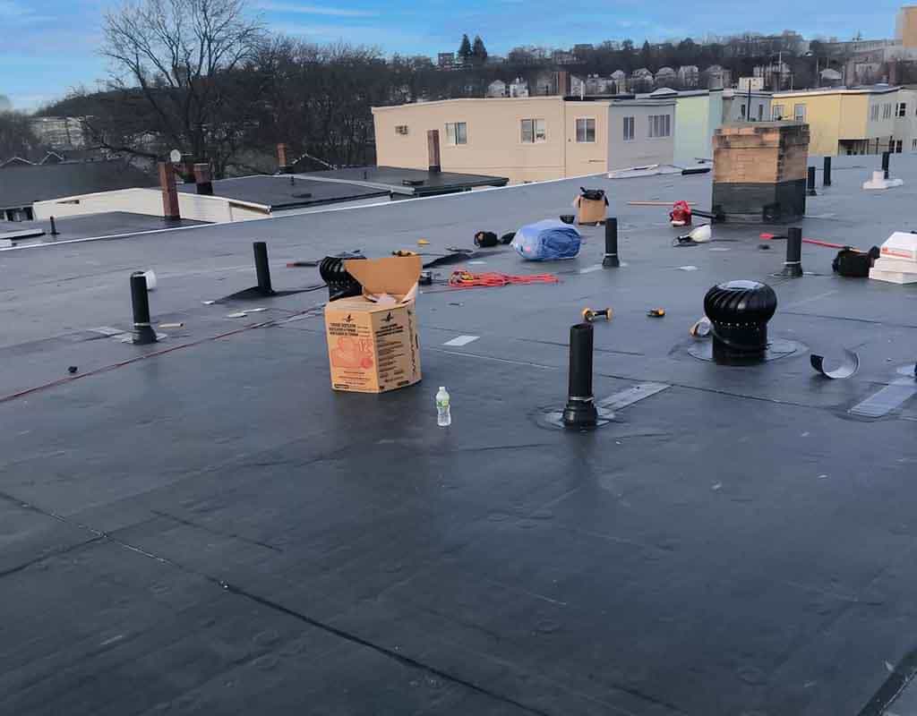 Rubber roofing in New England roofing services, Halley Construction Services, type roof.